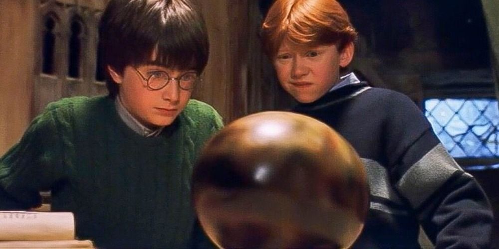 Harry and Ron looking at a dragon egg