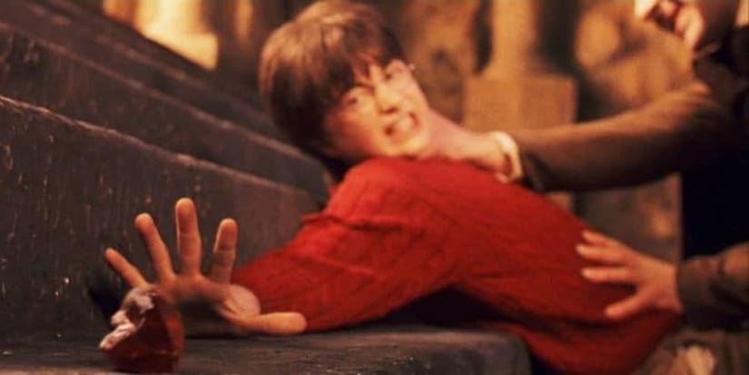 Harry being pinned down by Quirrell in The Philosopher's Stone