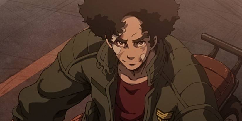 Megalobox's Joe on his bike looking up at the camera with a confident smile on his face.