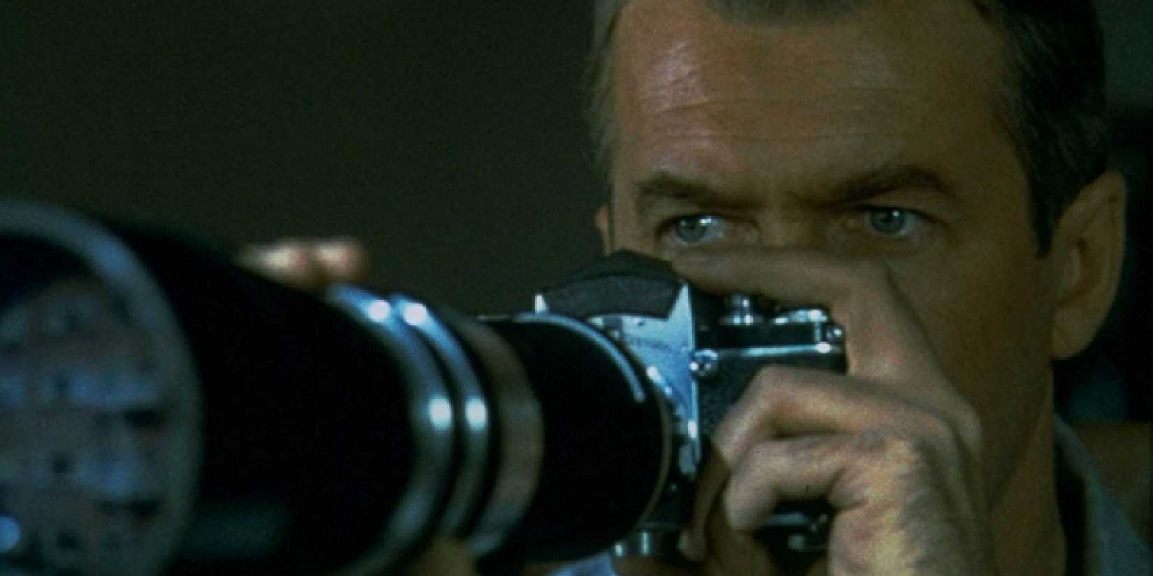 Man holding a camera in Rear Window