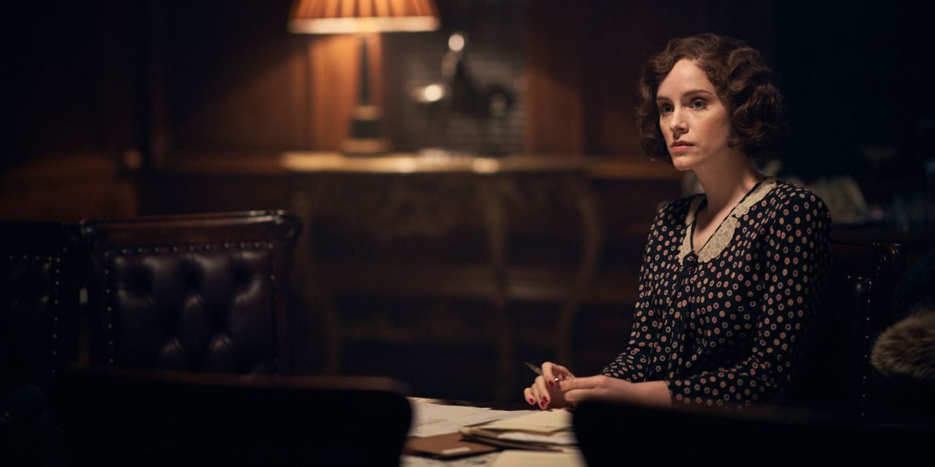 Ada Shelby in the office of their business at night doing paperwork