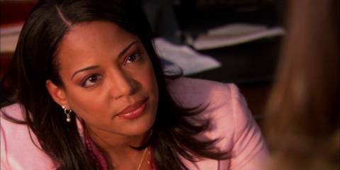 Maria LaGuerta in Dexter looking at someone off camera.