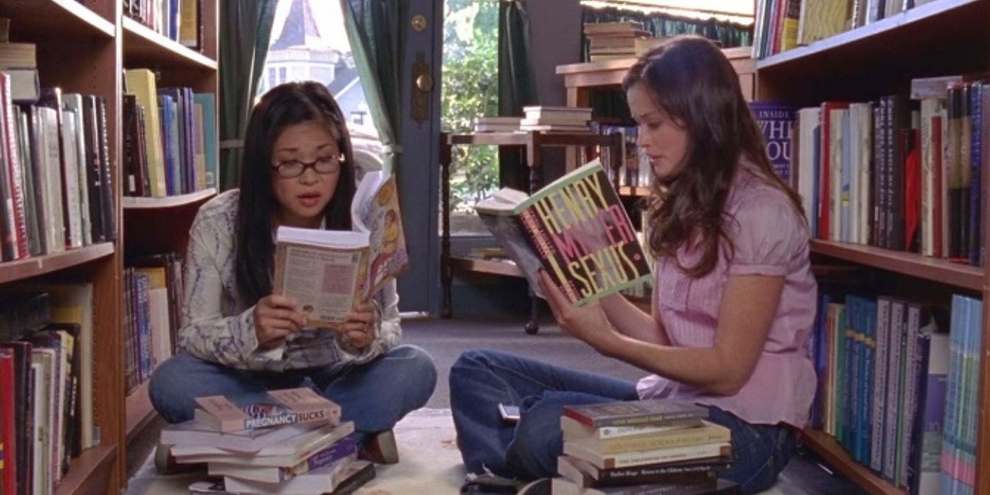 Rory and Lane read in the library on Gilmore Girls