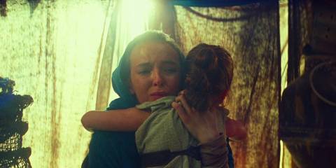 Jodie Comer as Rey's Mother hugging young Rey in Star Wars: The Rise of Skywalker