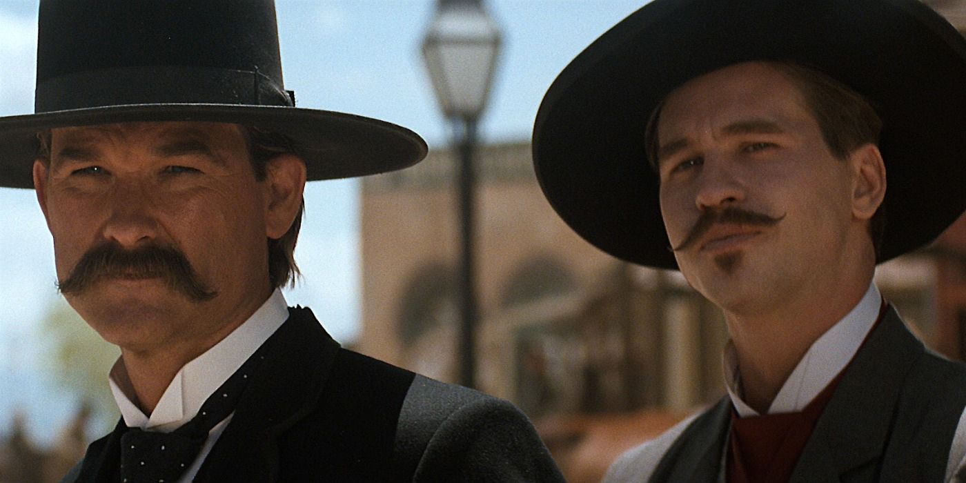 Wyatt Earp (Kurt Russell) and Doc Holliday (Val Kilmer) preparing for a showdown in Tombstone.