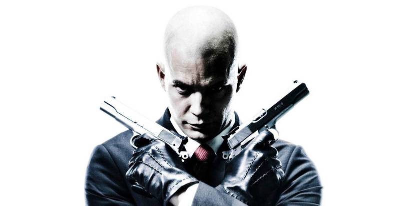 The Hitman (Timothy Olyphant) poses with two pistols from the film Hitman