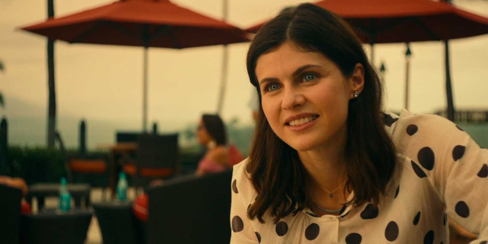 Alexandra Daddario as Rachel Patton sitting by the pool in The White Lotus