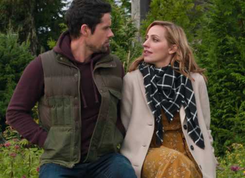 Brady and Brie sit next to each other and talk in Virgin River