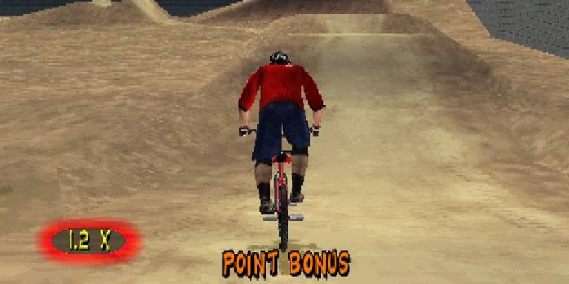 Rider approaches a dirt mound in TJ Lavin's Ultimate BMX video game