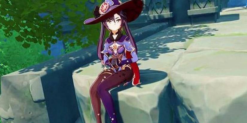 Mona sitting down in Genshin Impact