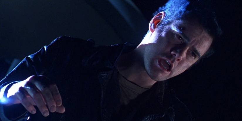 The Cable Guy staring at down at the satellite dish in The Cable Guy