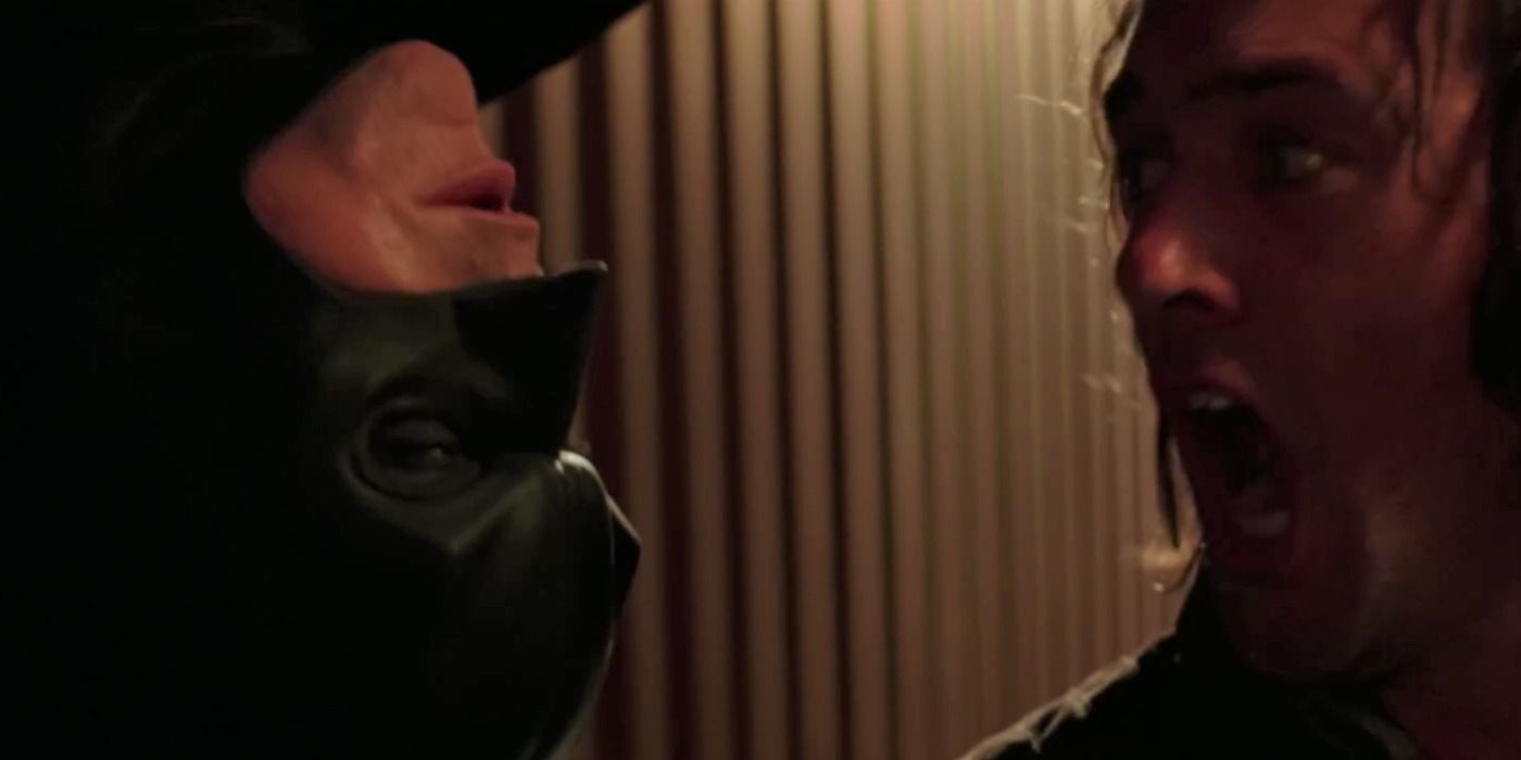 Batman taking out a Falcone thug in Batman Begins