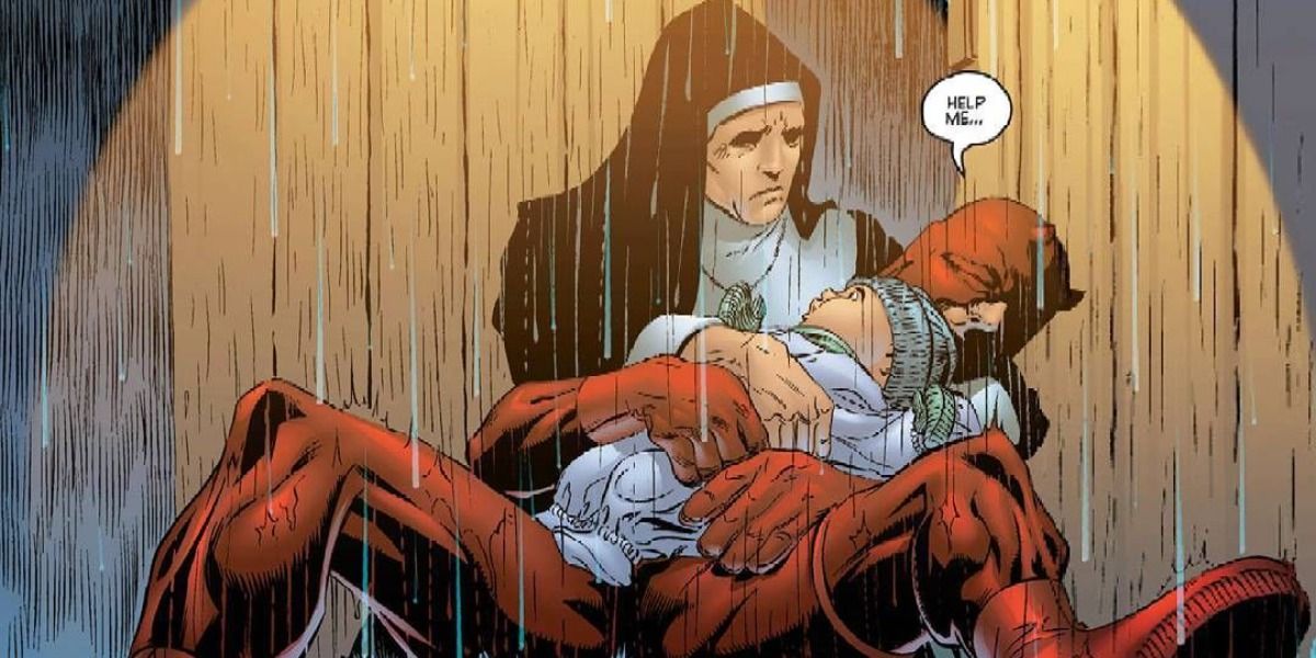 Daredevil holds a baby in Sister Maggie's arms.
