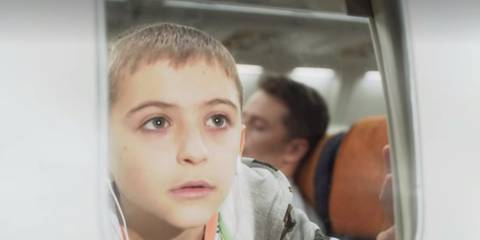 Cal looking out the window on the plane in Manifest