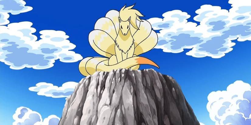 Ninetales sits atop a mountain looking down in the Pokemon anime.