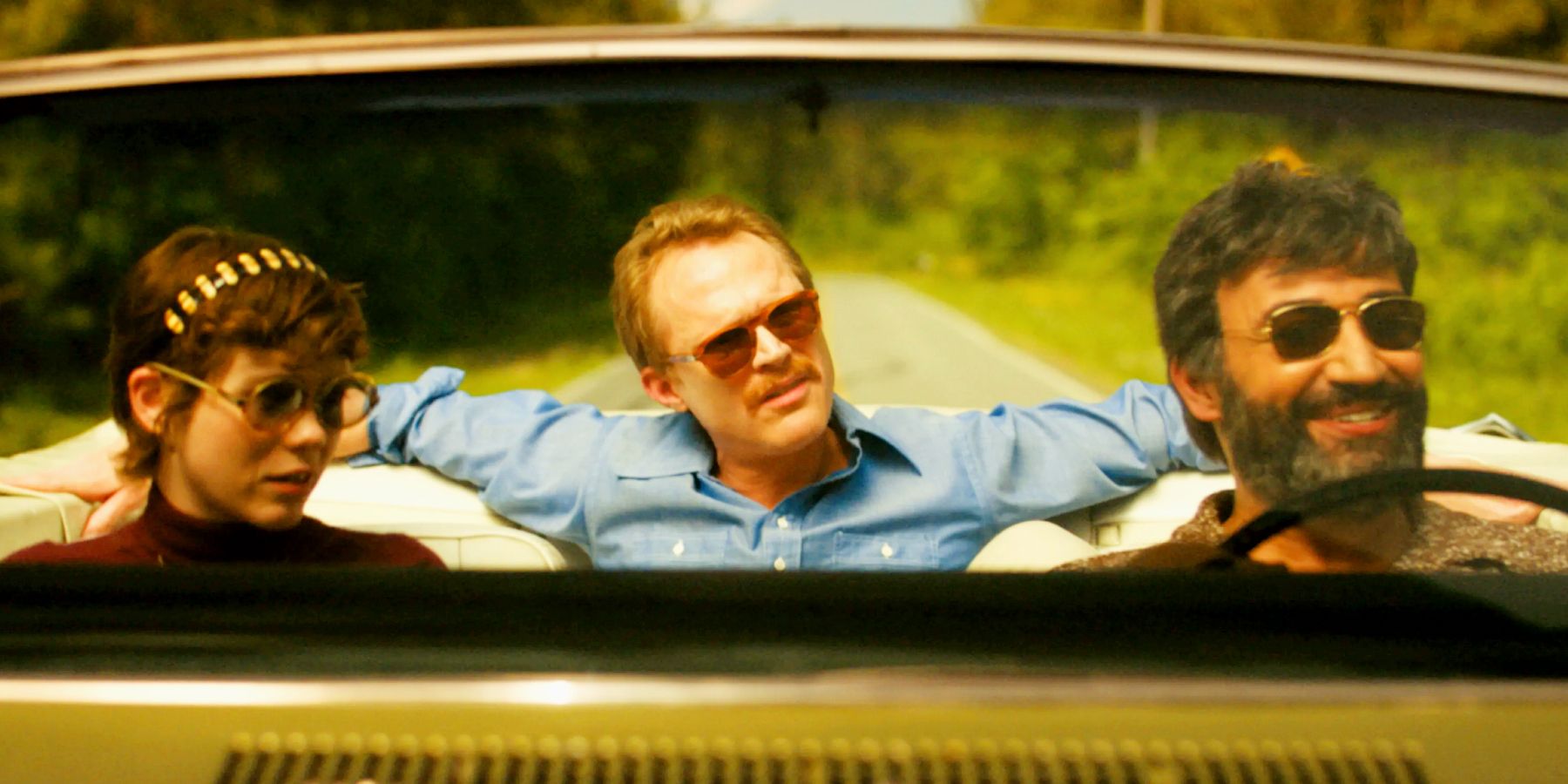 Sophia Lillis as Beth with Paul Bettany as Frank and Peter Macdissi as Wally on the road in Uncle Frank