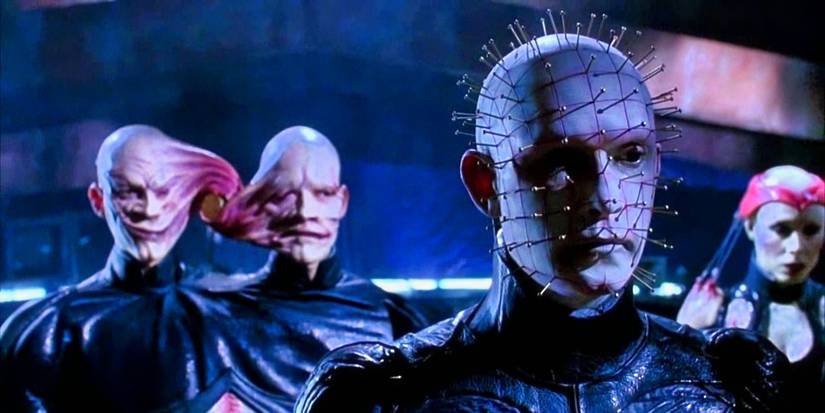 Pinhead standing in front of the Twins and Angelique in hellraiser bloodline