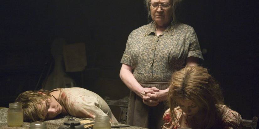 Bailey sits at dinner table in The Texas Chainsaw Massacre: The Beginning