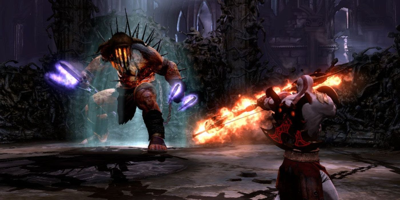 Hades charges at Kratos in God of War 3.