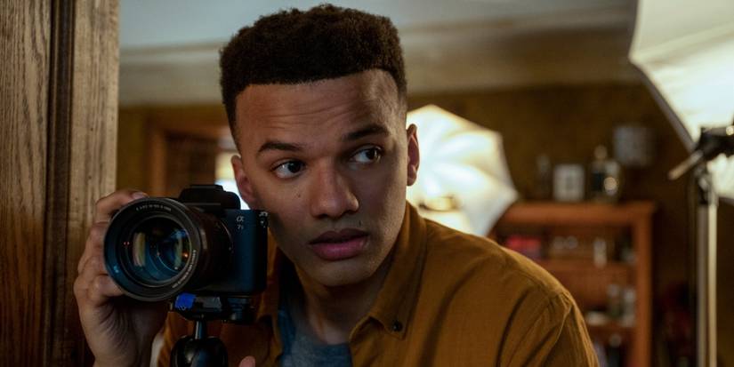 Scot Cavendish holding a camera in Locke &amp; Key