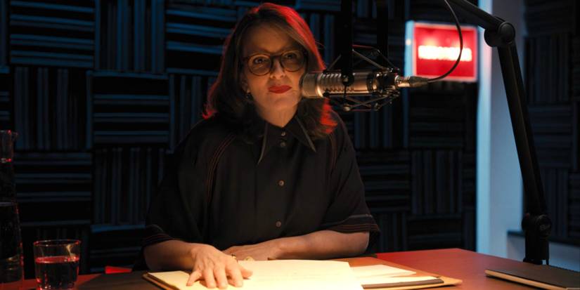 Cinda Canning talking to a microphone in Only Murders in the Building