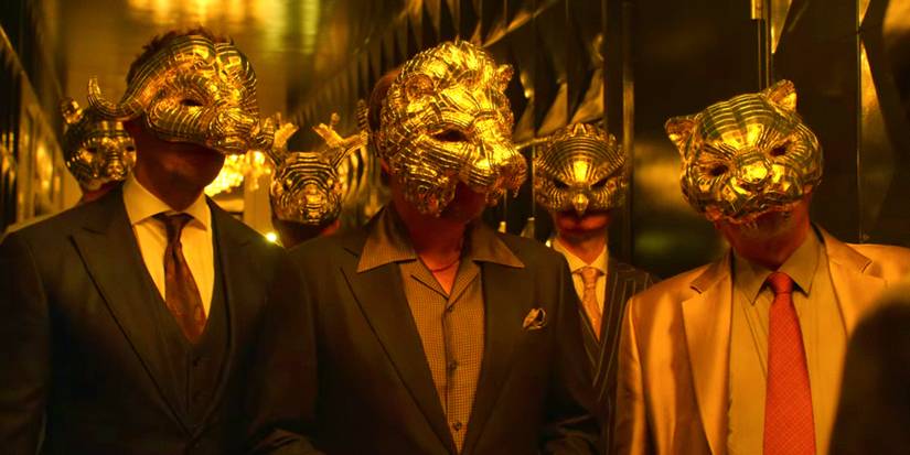 Squid Game VIPs wearing golden masks