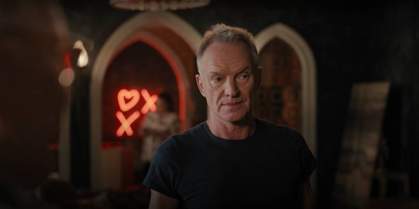 Sting stands in his apartment living room in Only Murders in the Building