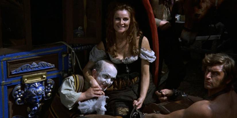 The members of the Vampire Circus sitting on a wagon