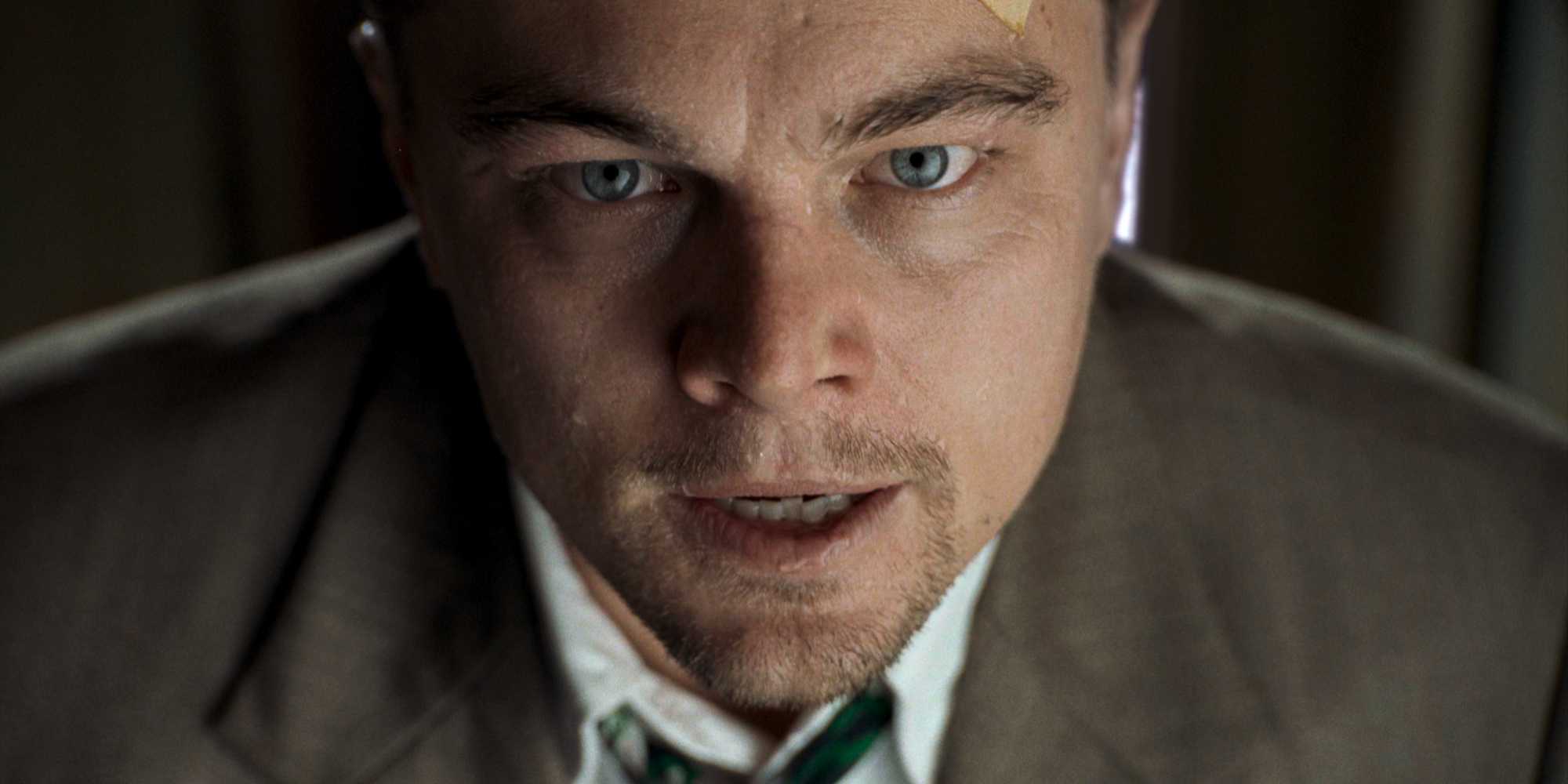 Leonardo DiCaprio looking serious and talking in Shutter Island