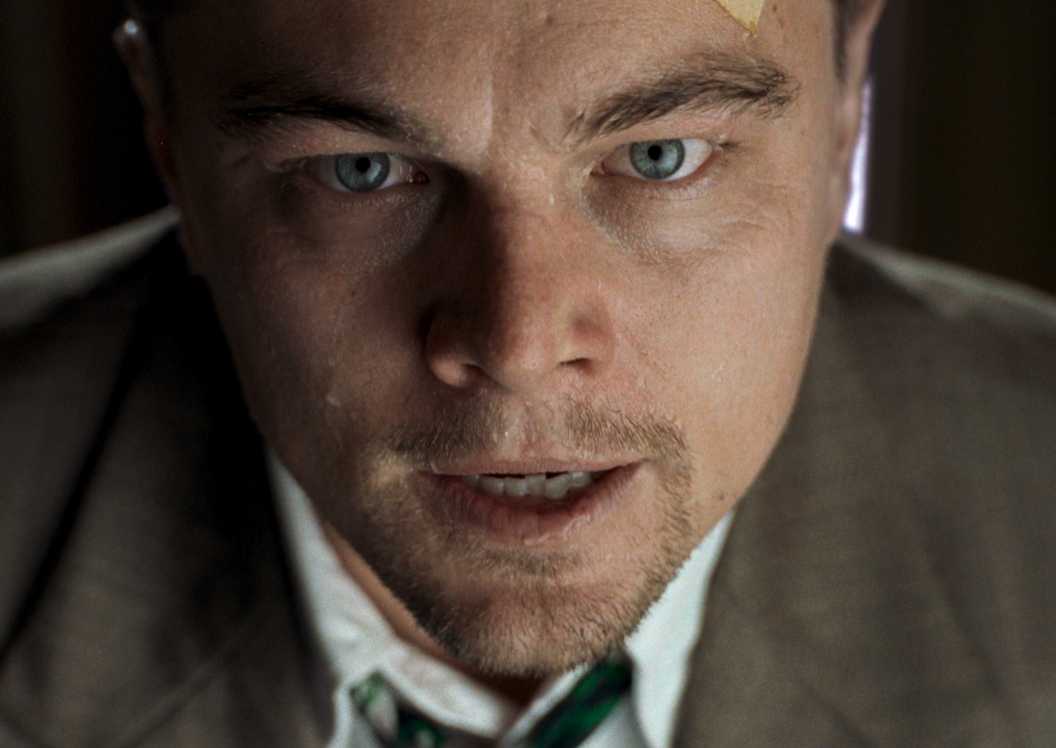 Leonardo DiCaprio looking serious and talking in Shutter Island