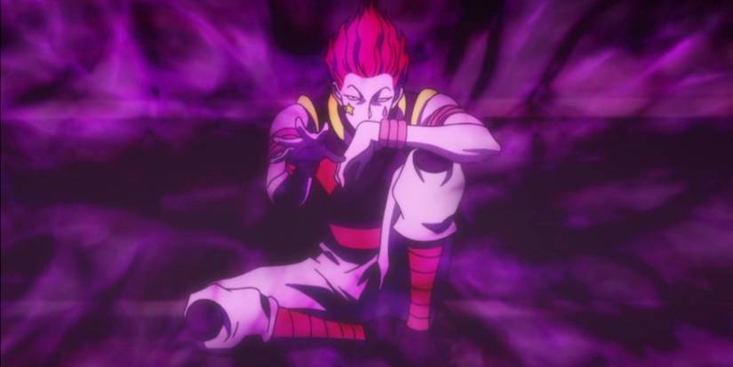 Hisoka surrounded by purple energy in Hunter x Hunter