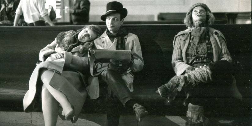 Lucille Ball dressed in rags on a bench in Stone Pillow