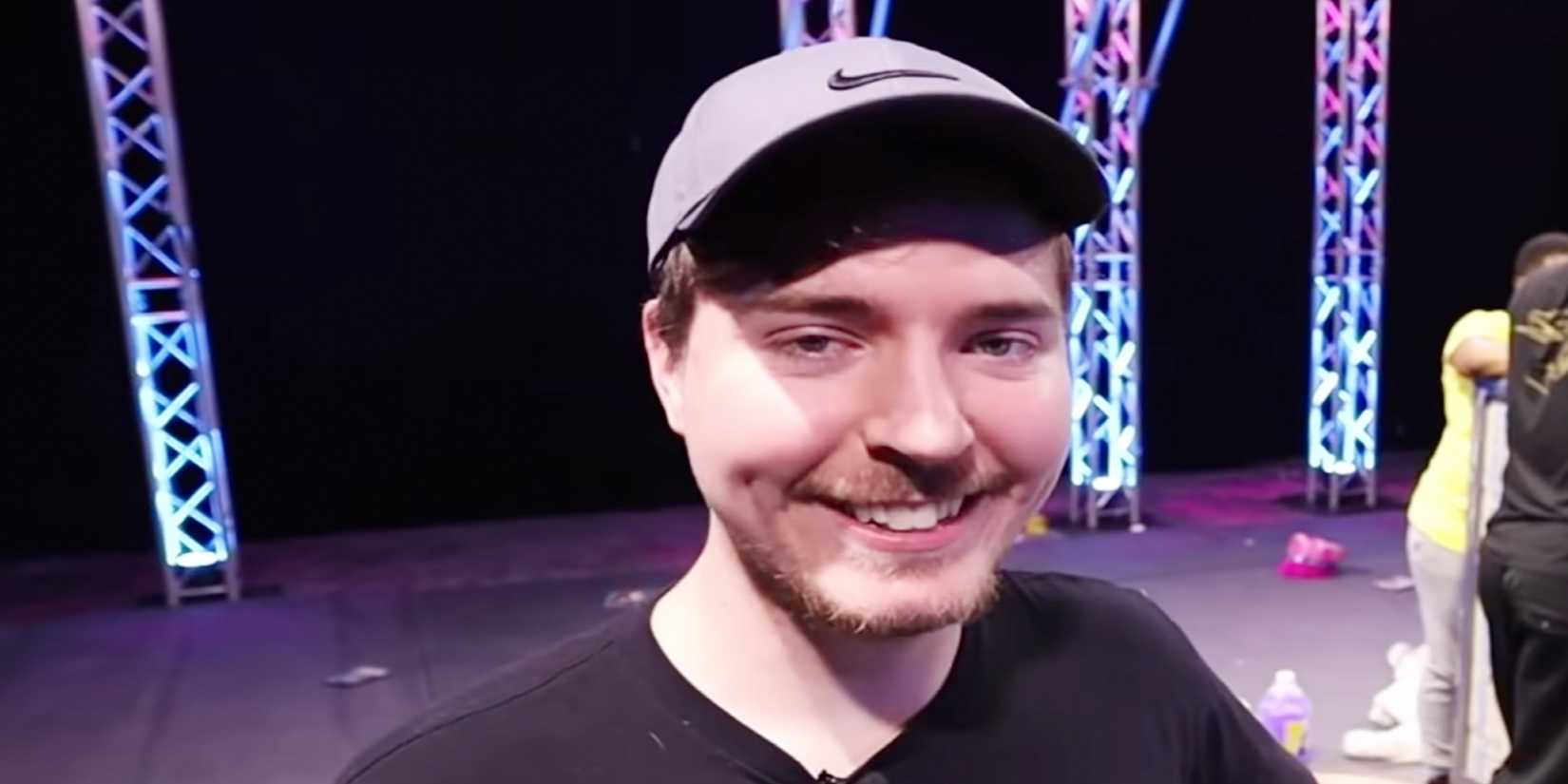 MrBeast grins on stage