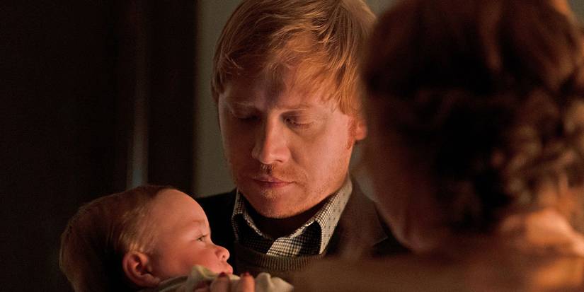 Rupert grint holding a baby in the show, Servant