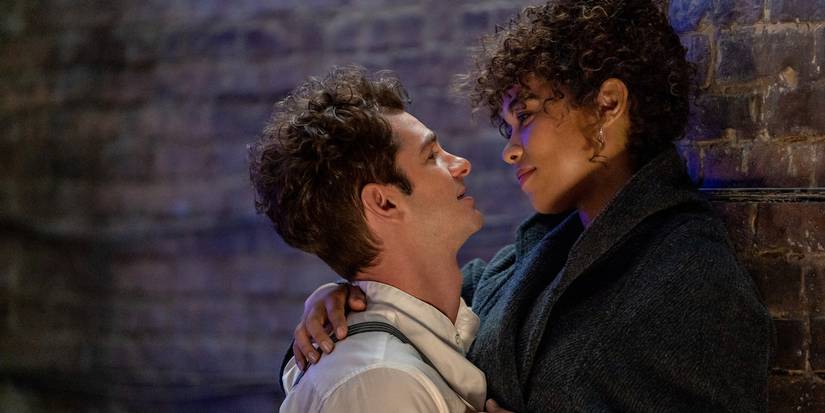Andrew Garfield and Alex Shipp embracing against a wall in Tick, Tick... Boom 