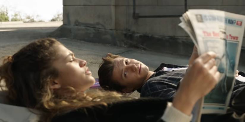 MJ reading a newspaper lying down next to Peter Parker in Spider-Man: No Way Home