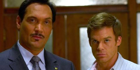 Dexter Morgan (Michael C. Hall) and Miguel Prado (Jimmy Smits) standing together in Season 3 of Dexter