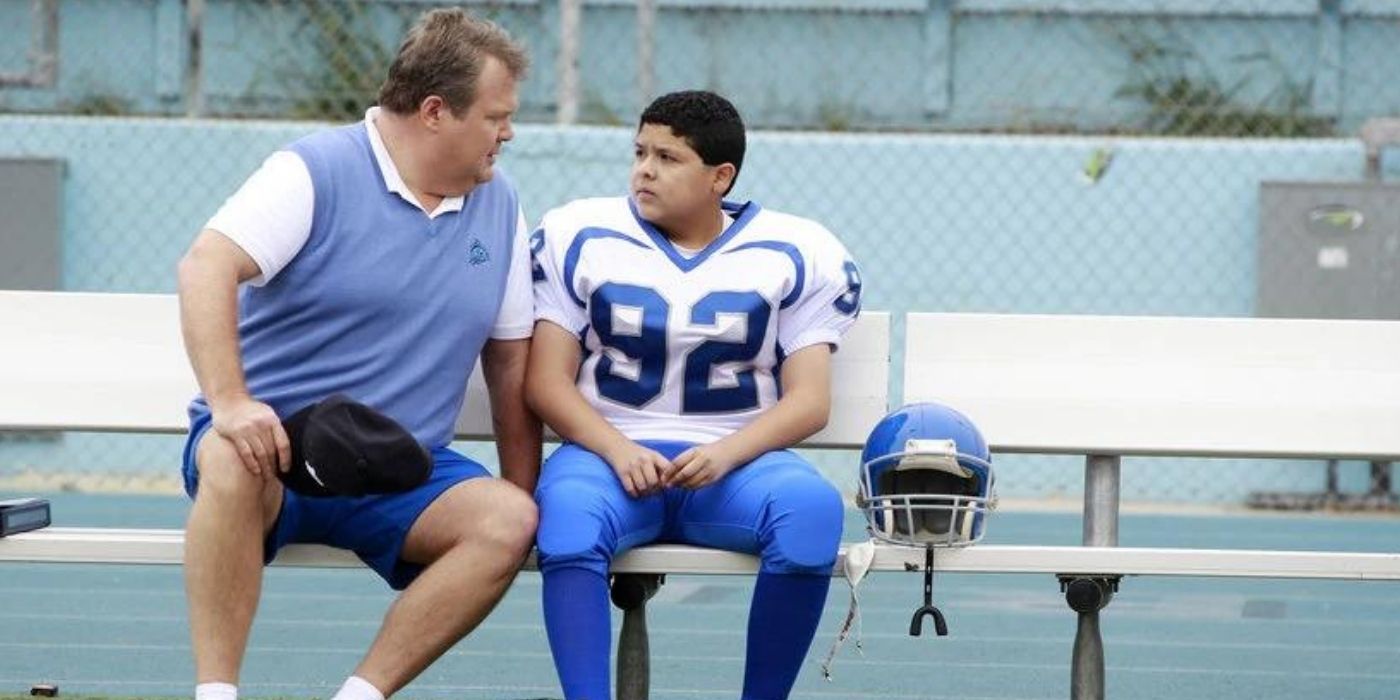 Cam and Manny on the football bench on Modern Family