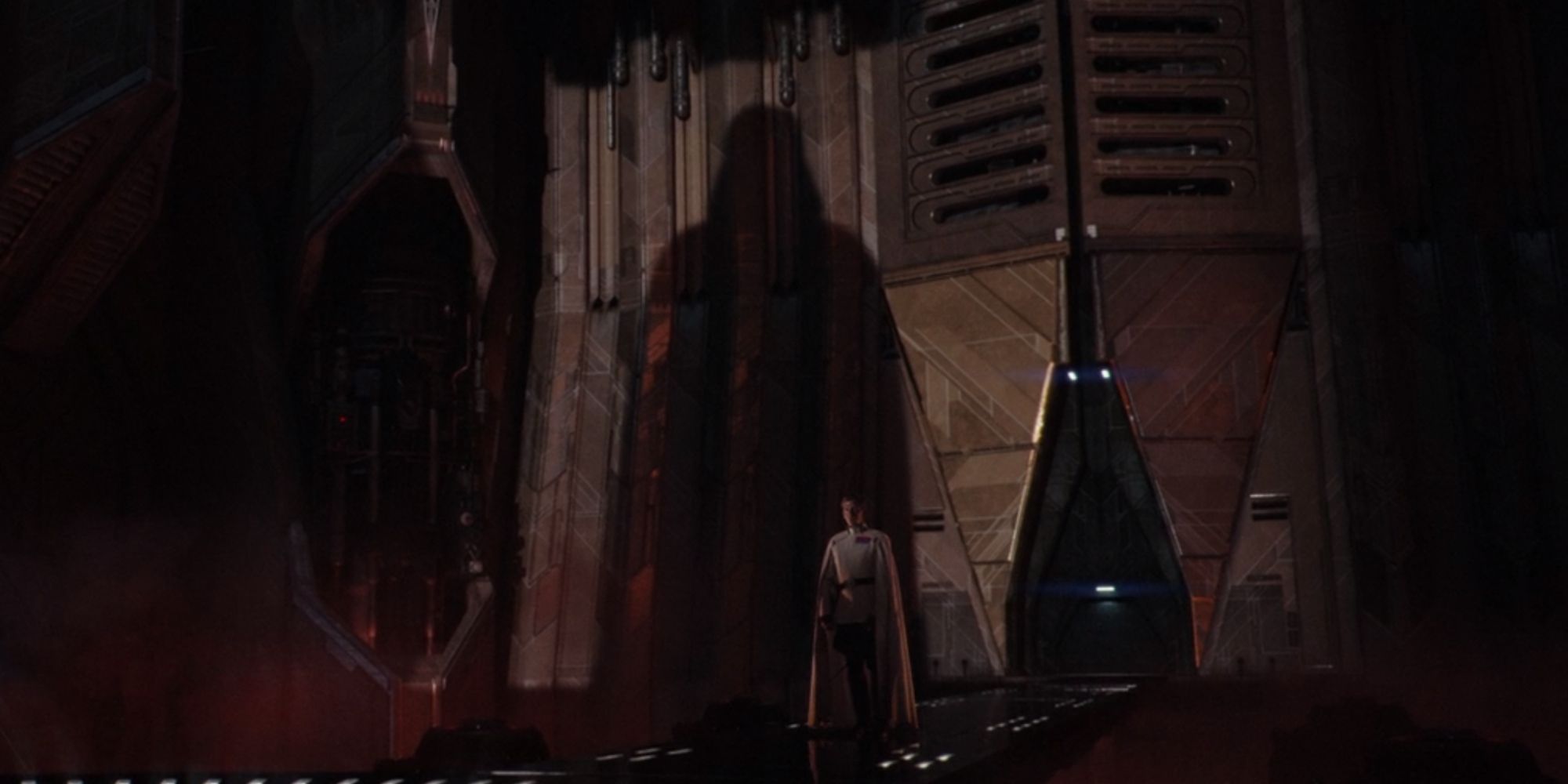 Darth Vaders shadow casting on the temple walls as Director Krennic watches in Rogue One A Star Wars Story