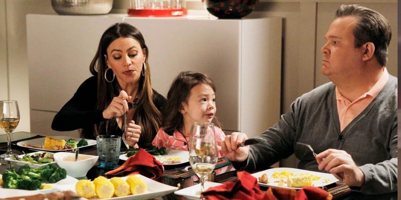 Gloria eating with Lily and Cam on Modern Family