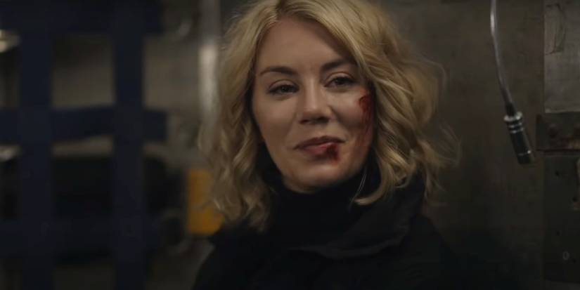 Jennifer Holland as Emilia Harcourt looking pleased with herself in Peacemaker