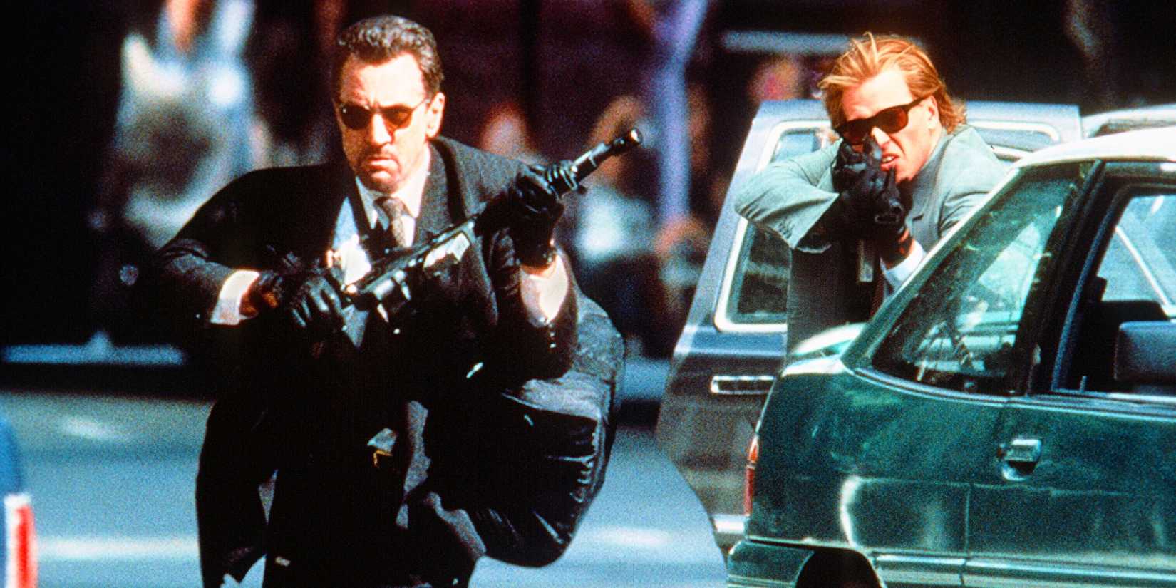 Val Kilmer runs with a gun in Heat