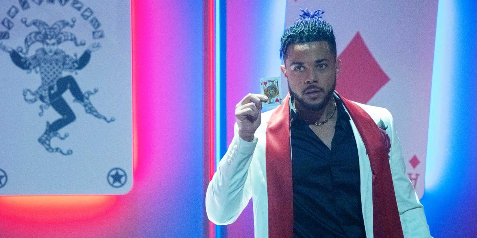 Marquis holds up a playing card in Batwoman