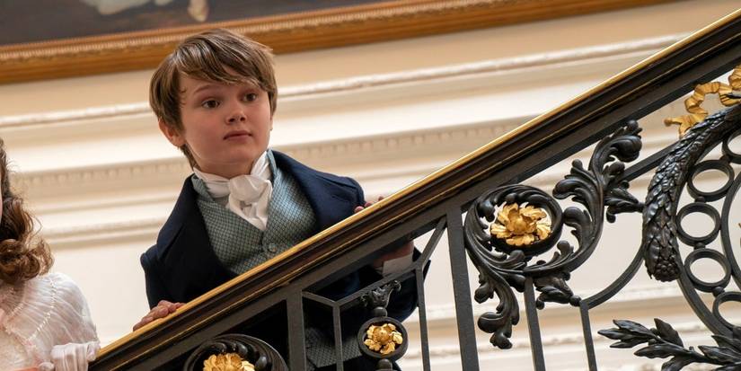 Gregory Bridgerton standing on the stairs and looking over the banister in Bridgerton season 1