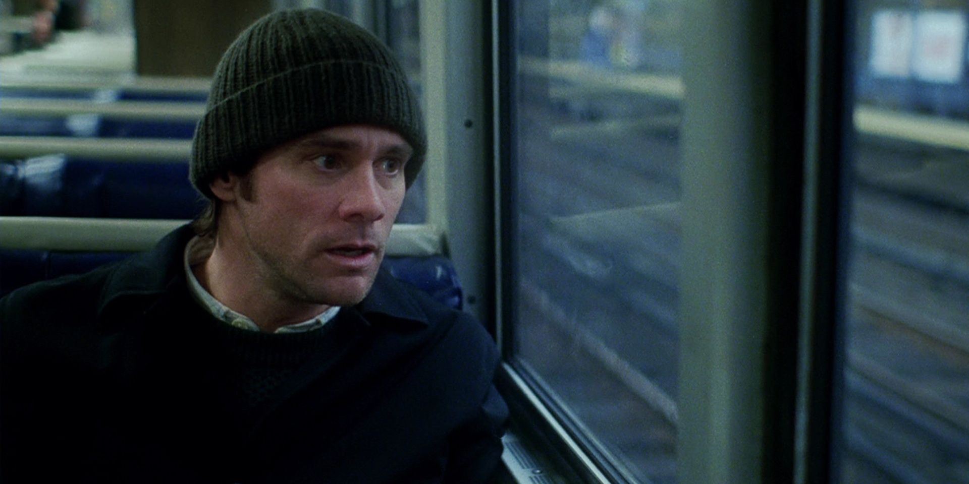 Jim Carrey on a train in Eternal Sunshine Of The Spotless Mind Cropped