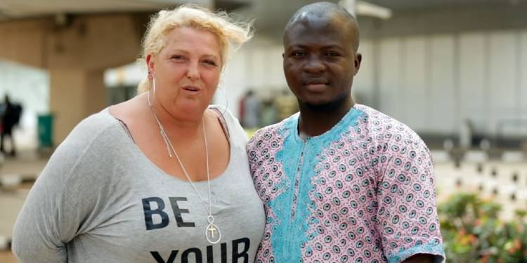 Angela Deem and Michael Ilesanmi from 90 Day Fiancé posing outside