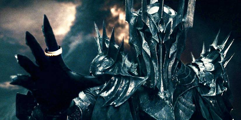 Sauron wearing the One Ring reaching out his hand in The Lord of the Rings.