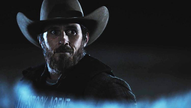 Lee Dutton looks at Kayce (off-camera) in Yellowstone