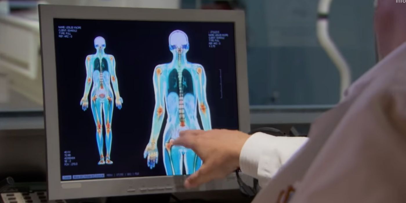 A doctor looking at Leslies scan on Parks and Rec