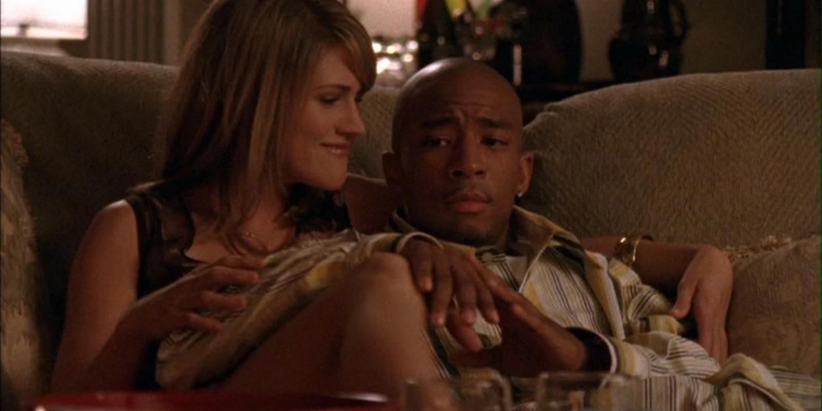 Bevin Mirskey and Skills Taylor cuddle on the couch in One Tree Hill